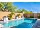 Stunning pool with three water features and a stone patio at 28001 N 92Nd Ave, Peoria, AZ 85383