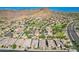 Aerial view of a luxury community with mountain views and houses with solar panels at 28001 N 92Nd Ave, Peoria, AZ 85383