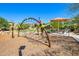 Modern playground with climbing features and shade structure at 28001 N 92Nd Ave, Peoria, AZ 85383