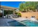 Luxury pool and spa with outdoor kitchen and seating area at 28001 N 92Nd Ave, Peoria, AZ 85383