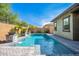 Inviting rectangular pool, three water features, and lush landscaping at 28001 N 92Nd Ave, Peoria, AZ 85383