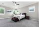 Spacious bedroom with carpeted floors and ceiling fan at 28001 N 92Nd Ave, Peoria, AZ 85383
