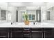 Bathroom with double vanity and large mirror at 28001 N 92Nd Ave, Peoria, AZ 85383