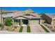 Single-story home with brick driveway and landscaped yard at 28001 N 92Nd Ave, Peoria, AZ 85383