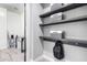 Laundry room with shelving, hooks, and built-in storage at 28001 N 92Nd Ave, Peoria, AZ 85383