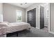 Guest bedroom with double doors and window at 28001 N 92Nd Ave, Peoria, AZ 85383