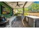 Outdoor kitchen with stainless steel appliances and stone countertops at 28001 N 92Nd Ave, Peoria, AZ 85383