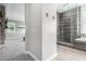 Bathroom with shower and view into bedroom at 28001 N 92Nd Ave, Peoria, AZ 85383