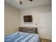 Bedroom with dresser and mounted TV at 3677 E Park Ave, Gilbert, AZ 85234