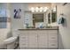 Elegant bathroom with double sinks and a large mirror at 3677 E Park Ave, Gilbert, AZ 85234