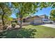 Single-story house with a two-car garage and manicured lawn at 3677 E Park Ave, Gilbert, AZ 85234