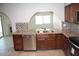 Updated kitchen with granite countertops and stainless steel appliances at 6604 W Vogel Ave, Glendale, AZ 85302