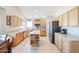 Kitchen with light wood cabinets, center island, and stainless steel appliances at 26028 N 66Th Dr, Phoenix, AZ 85083