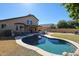 Entertain in style with this large kidney shaped pool and spacious backyard at 26028 N 66Th Dr, Phoenix, AZ 85083