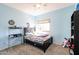 bedroom with a twin bed and built-in shelving at 26028 N 66Th Dr, Phoenix, AZ 85083