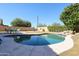 Inviting kidney-shaped pool with surrounding patio and lounge chairs at 26028 N 66Th Dr, Phoenix, AZ 85083