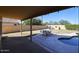Covered patio, pool, and grassy backyard with seating area at 26028 N 66Th Dr, Phoenix, AZ 85083