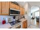 Kitchen with microwave, stovetop, and built-in oven at 26028 N 66Th Dr, Phoenix, AZ 85083