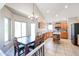 Eat-in kitchen with an island and view to the Gathering room at 26028 N 66Th Dr, Phoenix, AZ 85083