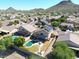 Aerial view showing house with pool, solar panels, and mountain views in a residential neighborhood at 26028 N 66Th Dr, Phoenix, AZ 85083