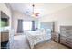 Spacious main bedroom with a large bed and ceiling fan at 26028 N 66Th Dr, Phoenix, AZ 85083