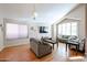 Living room with hardwood floors, vaulted ceiling, and ample natural light at 26028 N 66Th Dr, Phoenix, AZ 85083