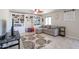 Gathering room with built-in shelving and comfortable seating at 26028 N 66Th Dr, Phoenix, AZ 85083