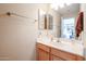 Simple bathroom with wood vanity and a mirror at 26028 N 66Th Dr, Phoenix, AZ 85083