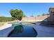 Inviting kidney-shaped pool with surrounding patio and lounge chairs at 26028 N 66Th Dr, Phoenix, AZ 85083