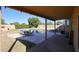 Covered patio, pool, and grassy backyard with seating area at 26028 N 66Th Dr, Phoenix, AZ 85083