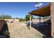 Large backyard with a covered patio, pool, and plenty of space for entertaining at 26028 N 66Th Dr, Phoenix, AZ 85083