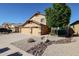 Two-story house with a three-car garage and landscaped yard at 26028 N 66Th Dr, Phoenix, AZ 85083