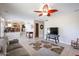 Spacious living area with open floor plan, showing kitchen and stairs at 26028 N 66Th Dr, Phoenix, AZ 85083
