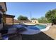 Inviting kidney-shaped pool with surrounding patio and lounge chairs at 26028 N 66Th Dr, Phoenix, AZ 85083