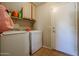 Laundry room with washer, dryer, and extra storage at 26028 N 66Th Dr, Phoenix, AZ 85083