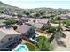 Aerial view showing a house with a pool and solar panels, situated in a neighborhood near mountains at 26028 N 66Th Dr, Phoenix, AZ 85083
