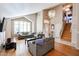 Bright living room with hardwood floors, staircase, and open floor plan at 26028 N 66Th Dr, Phoenix, AZ 85083