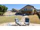 Spacious backyard with a pool, patio seating, and fire pit at 26028 N 66Th Dr, Phoenix, AZ 85083