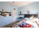 Bright bedroom with a double bed, desk, and ample closet space at 26028 N 66Th Dr, Phoenix, AZ 85083