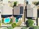 Aerial view of house with pool and solar panels, surrounded by other homes and desert landscape at 26028 N 66Th Dr, Phoenix, AZ 85083