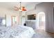 Main bedroom with a king-size bed and access to bathroom at 26028 N 66Th Dr, Phoenix, AZ 85083