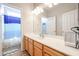 Clean bathroom with wood cabinets and a shower/tub combo at 26028 N 66Th Dr, Phoenix, AZ 85083