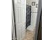 Small bathroom with shower and patterned shower curtain at 18527 W Caribbean Ln, Surprise, AZ 85388