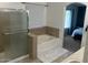 Bathroom featuring a garden tub, shower, and updated flooring at 18527 W Caribbean Ln, Surprise, AZ 85388