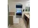 Main bathroom with double sinks and a view into the bedroom at 18527 W Caribbean Ln, Surprise, AZ 85388