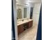 Double vanity bathroom with large mirror and ample storage at 18527 W Caribbean Ln, Surprise, AZ 85388