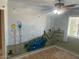 bedroom with painted mural and new flooring at 18527 W Caribbean Ln, Surprise, AZ 85388