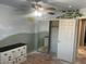 Bright bedroom with mirrored closet doors and painted wall accents at 18527 W Caribbean Ln, Surprise, AZ 85388