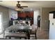 Bright kitchen with an island, ample cabinetry, and a dining area at 18527 W Caribbean Ln, Surprise, AZ 85388