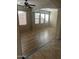 Spacious living room with hardwood floors and large windows at 18527 W Caribbean Ln, Surprise, AZ 85388